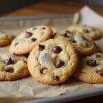 Deliciously baked cottage cheese chocolate chip cookies on a baking sheet.