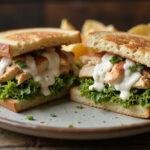 Delicious grilled chicken caesar salad sandwich presentation, perfect for a satisfying lunch, highlighting fresh ingredients and vibrant colors.
