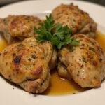 Deliciously plated air fryer chicken thighs garnished with fresh herbs, showcasing the final result of frozen chicken thighs in air fryer.