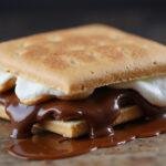 Delicious close-up of air fryer s'mores, highlighting ooey gooey marshmallows and rich chocolate.