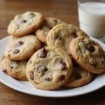 deliciously baked chick fil a chocolate chip cookies presented on a plate with a glass of milk, perfect for dessert.
