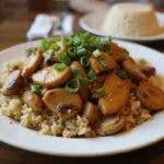 Delicious chicken and mushroom stir fry served on a plate, perfect for a satisfying meal.