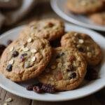 Delicious classic oatmeal raisin cookies made with Quaker oats displayed on a plate, perfect for enjoying fresh from the oven with a vegan gluten-free twist.
