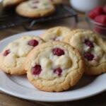 Deliciously baked fruity white chocolate cookies displayed on a plate, perfect for enjoying as a tasty snack or dessert.