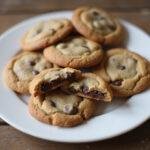 Freshly baked mini chocolate chip cookies arranged on a plate, showcasing their delightful texture and mini chocolate chips, perfect for a snack or dessert.