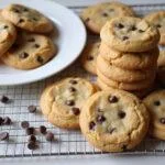 Deliciously baked Nestle Toll House chocolate chip cookies cooling on a rack, showcasing their golden color and soft texture, perfect dessert treat.