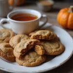 Final presentation of pumpkin spice cookies on a rustic table, showcasing the delicious pumpkin spice cookie recipe.