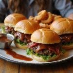 Gorgeous presentation of roast beef sliders served with onion rings and barbecue sauce, showcasing the ultimate roast beef dishes for gatherings.