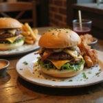 Deliciously presented smash burger recipe blackstone on a wooden table with fries and sauce, perfect for a satisfying meal.