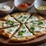 Delicious cottage cheese flatbread air fryer recipe beautifully served with dips and garnishes on a rustic table.