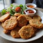 Final presentation of golden brown chicken nuggets from the air fryer, showcasing the delightful dish of frozen chicken nuggets in air fryer.