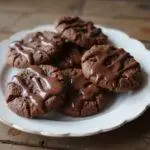 Delectable chocolate and caramel cookies displayed on a plate, highlighting their rich flavors and tempting appearance.