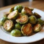 Crispy air fried brussels sprouts served as a delicious side dish, perfect for any meal.