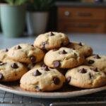 Delicious eggless chocolate chip cookies beautifully presented on a plate, showcasing the perfect homemade dessert.