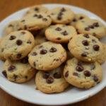 Deliciously baked eggless chocolate chip cookies, showcasing the final result of an eggless chocolate chip cookies recipe with gooey chocolate chips.