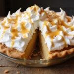 Deliciously finished Honeydukes Butterbeer Float Pie served beautifully with whipped cream and butterscotch topping, ready to enjoy.