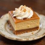 Delicious Hufflepuff Caramel Butterbeer Cheesecake Bars with a Buttery Shortbread Crust, ready to be enjoyed, showcasing the delightful creamy texture and caramel topping.