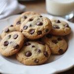 Final presentation of low sugar chocolate chip cookies, golden and chocolatey, perfect for a healthy dessert option.