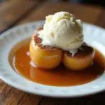 Delicious air fryer baked apples served with caramel and ice cream, a perfect dessert treat.