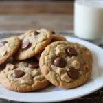 delicious toffee chocolate chip cookies on a cooling rack paired with milk