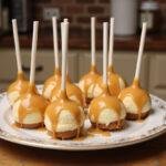 Final presentation of Harry Potter Butterbeer Cheesecake Pops with gleaming butterscotch drizzle, perfect for a magical dessert experience.