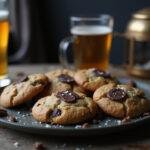 Final presentation of Slytherin’s Serpent's Whisper Butterbeer Cookies with Dark Chocolate, inviting and delicious, paired with a glass of butterbeer for a magical touch.