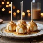 Deliciously crafted Enchanted Hogwarts Butterbeer Cheesecake Pops with chocolate drizzle, presented in a magical and inviting setting.