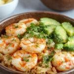 A vibrant Fiesta Shrimp Rice Bowl featuring grilled shrimp, colorful vegetables, and fresh herbs served in a bowl