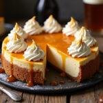 Delicious Harry Potter Rich Butterbeer Cheesecake with whipped cream and butterscotch drizzle, ready to enjoy.