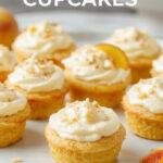 Delicious Honey Peach Cream Cheese Cupcakes arranged on a white plate, topped with fresh peach slices and a drizzle of honey, garnished with mint leaves.