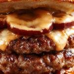 A close-up of a juicy, perfectly cooked burger with melted cheese, crispy bacon, fresh lettuce, tomato slices, and pickles on a toasted bun, garnished with a side of crispy fries and a dipping sauce, all presented on a rustic wooden board.