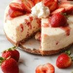 A beautifully plated slice of strawberry cheesecake featuring a golden-brown graham cracker crust, creamy white cheesecake filling topped with vibrant red strawberry slices and a glossy glaze, garnished with fresh mint leaves. The dessert is presented on a white plate with a drizzle of strawberry sauce, set against a soft pastel background with subtle lighting that highlights the textures and colors.