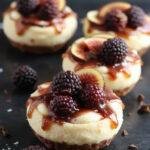 Delicious No-Bake Mikado Tart Deluxe with salted caramel, fresh blackberries, and fig mini cheesecakes arranged beautifully on a elegant platter.