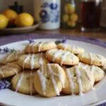 Delicious Ravenclaw Lemon Cookies with Lavender Glaze served on a decorative plate, highlighting the perfect finishing touch for a delightful treat.