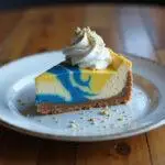 Final presentation of Ravenclaw Starry Night Butterbeer Cheesecake with Blue Velvet Swirl on a rustic table.