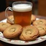 Delicious Weasley's Wizard Wheezes Love Potions Butterbeer Cookies arranged on a plate with butterbeer, showcasing the final delightful dessert creation.