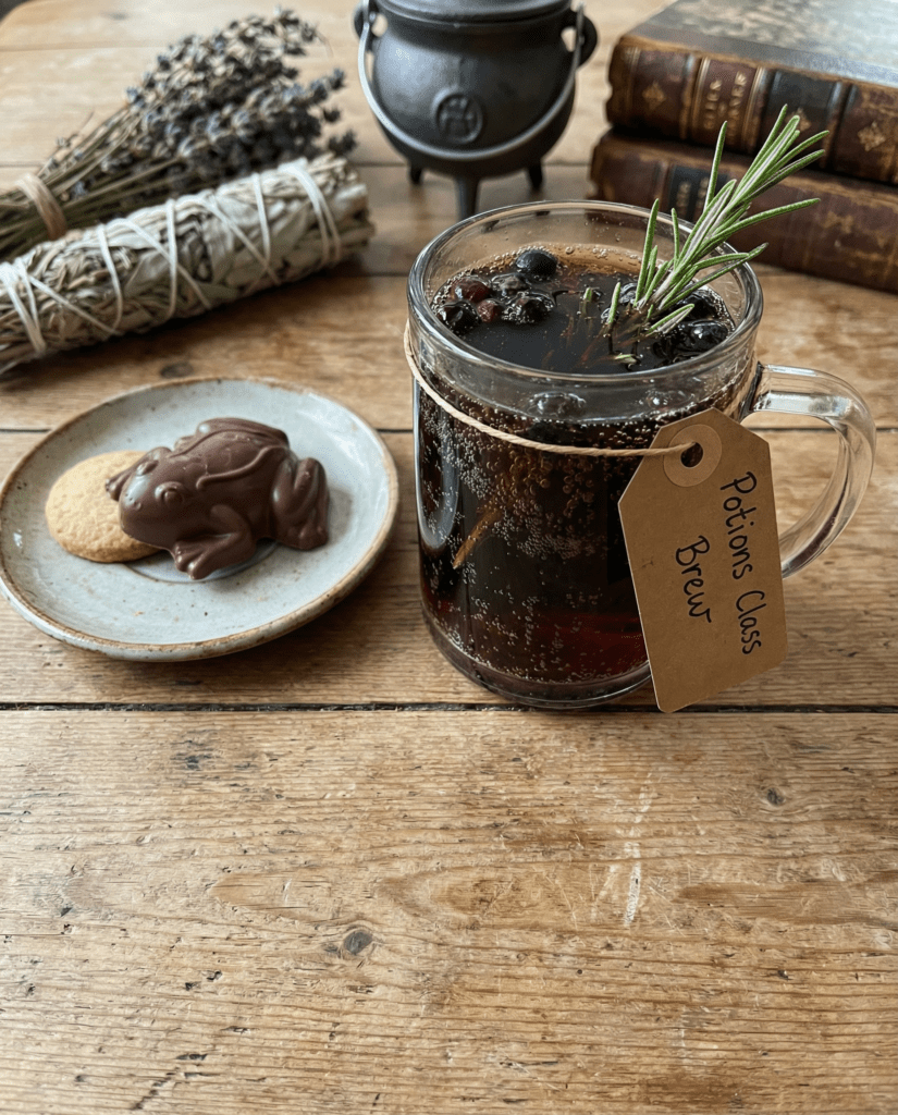 A vibrant glass filled with dark cola infused with magical herbs and glowing garnishes, styled on an aged wooden table with mystical lighting, featuring Harry Potter-themed props like a wand and a parchment scroll.
